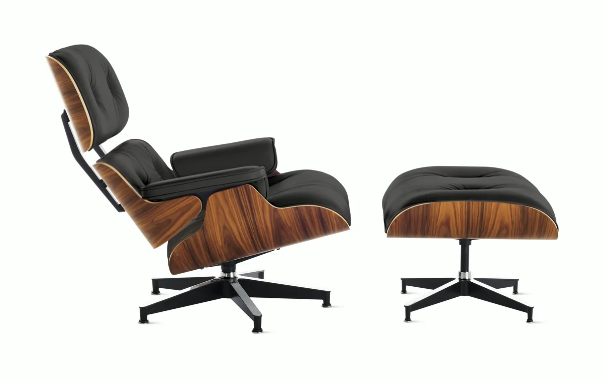 Eames Lounge Chair and Ottoman in Santos Palisander shells with black leather cushions